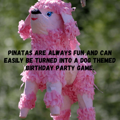 A pink dog pinata hanging up for the next dog themed birthday party.