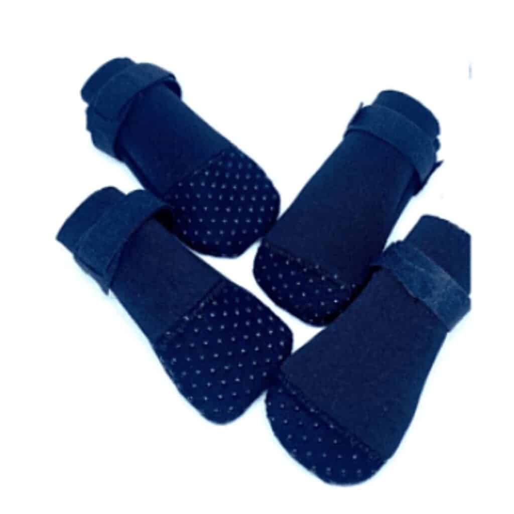 Picture of dark blue dog booties to protect dogs paws from the sun.
