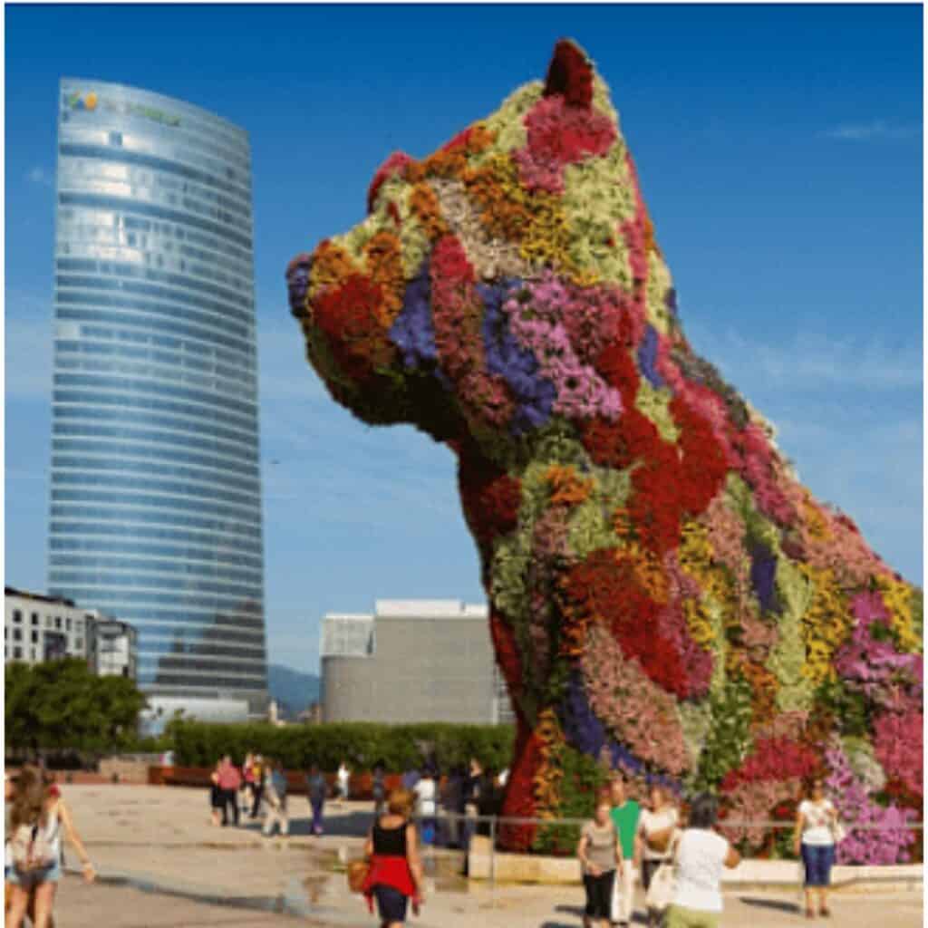 Dog art sculpture giant dog covered in flowers pictured in the City.